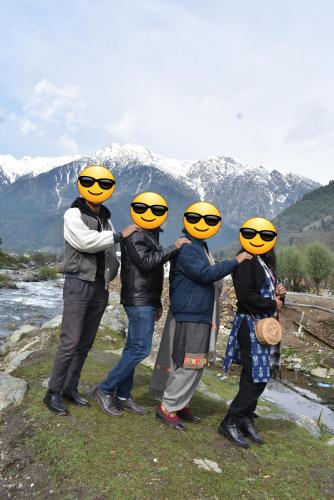 a group of people with yellow helmets on their heads at Al-Ayaan Guest House in Pahalgām