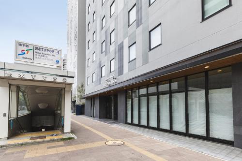 an empty street in front of a building at Sotetsu Fresa Inn Sapporo-Susukino in Sapporo