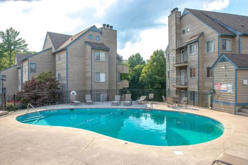 a swimming pool in front of a house at Gatlinburg Summit Smoky Mountains View in Gatlinburg