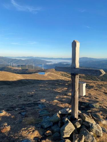a wooden cross on the top of a hill at Almhaus Chalet 607 - Lachtal in Oberwölz Stadt