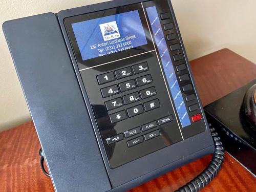 a small black phone sitting on top of a table at The Royal Hotel by Coastlands Hotels & Resorts in Durban