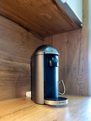 a coffee maker sitting on top of a wooden table at Apartment 4 guests with access to the beachFréjus in Fréjus
