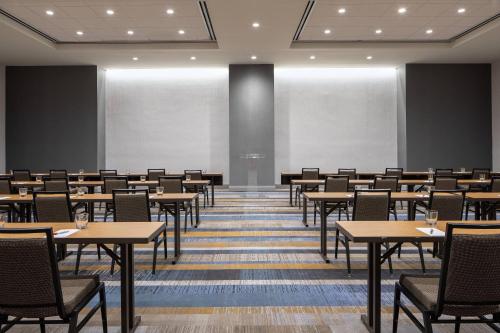 a classroom with tables and chairs in a room at Dallas/Plano Marriott at Legacy Town Center in Plano