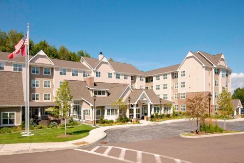 an exterior view of a hotel at Residence Inn Burlington Colchester in Burlington