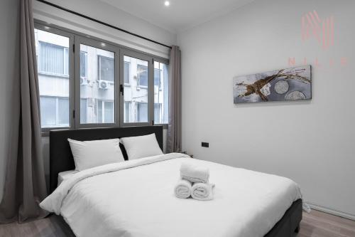 Säng eller sängar i ett rum på B&W, Nilie Hospitality MGMT