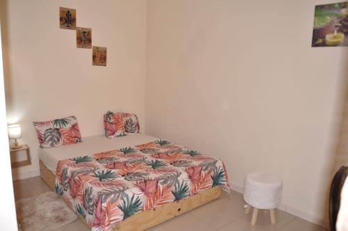 Tempat tidur dalam kamar di Dakar Top destination 2