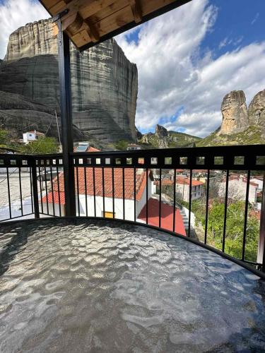 a balcony with a view of a mountain at Meteora Sunrise in Kalabaka