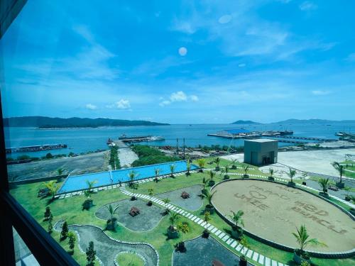 a view of the ocean from a hotel window at JQ1 SEA & POOL or CITY View WIFI I WASHING MACHINE for Some Units I CUCKOO WATER Jesselton Quay by R2 in Kota Kinabalu