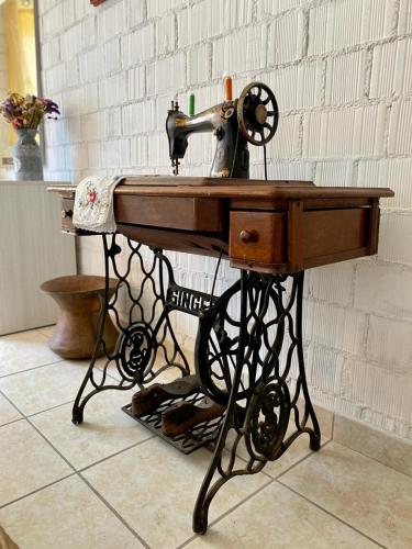 a sewing machine sitting on top of a table at L'Olivo - 1932 in Controguerra