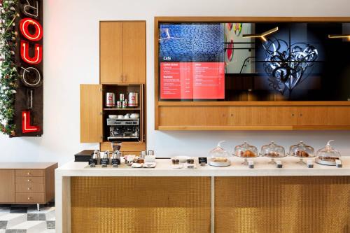 a kitchen with a counter with food on it at Le Meridien Columbus, The Joseph in Columbus