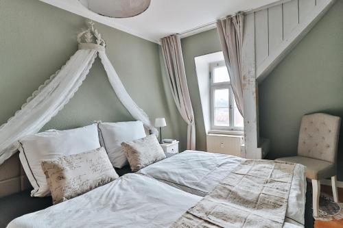 Postel nebo postele na pokoji v ubytování Altstadtliebe