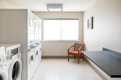 a laundry room with a washer and dryer at Residence Inn Largo Medical Center Drive in Largo