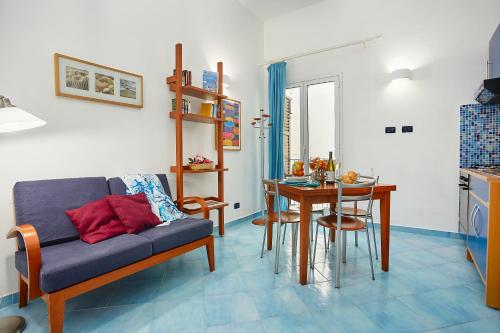 a living room with a couch and a table at Appartamenti Rosa Dei Venti in Trapani