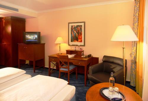 Katil atau katil-katil dalam bilik di H4 Hotel Kassel