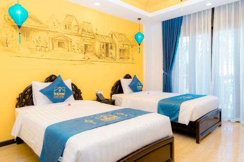 two beds in a room with a drawing on the wall at iHome Hoi An in Hoi An