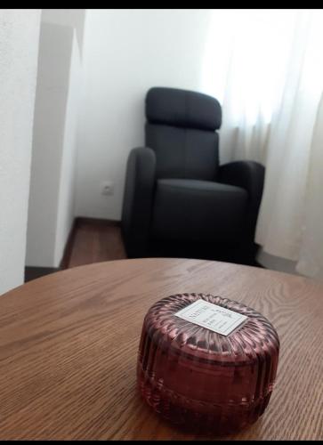 a wooden table with a brown object on top of it at Silene Studio in Craiova