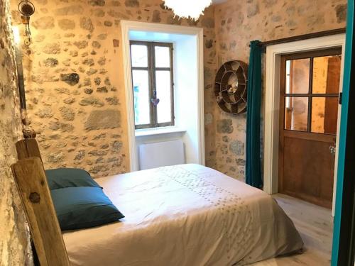 Postel nebo postele na pokoji v ubytování Du haut des remparts