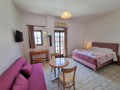 Postel nebo postele na pokoji v ubytování Arhodiko Hotel