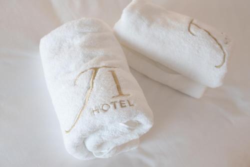 a white towel with the word hotel written on it at JI HOTEL 