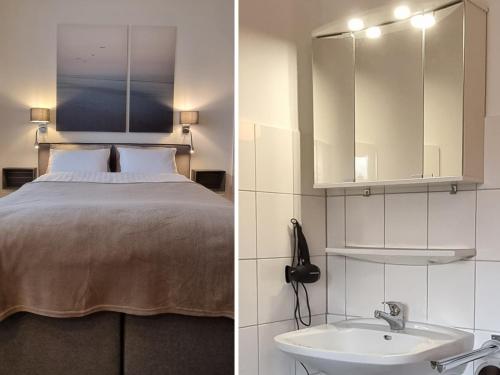 1 dormitorio con cama y lavamanos en Stay aWhile Apartment 5 Min zum GOP, BALI-Therme, HDZ & Klinik Nähe, Netflix, en Bad Oeynhausen
