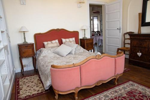 Een bed of bedden in een kamer bij La Licorne - 1ère étage - Centre Bourg