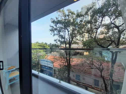 a window with a view of a building at Happy Home in Nha Trang