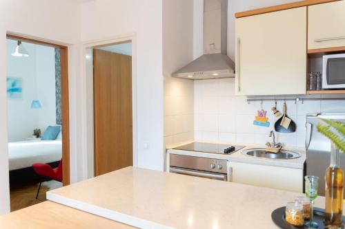 a kitchen with a sink and a counter top at Porto Albona in Rabac