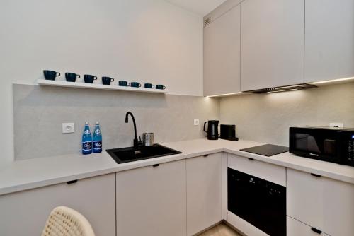 Кухня или мини-кухня в BlueApart Apartamenty Portowa
