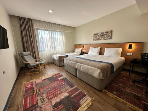 Postel nebo postele na pokoji v ubytování N'Ala Otel