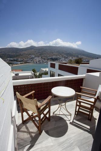 a patio with two chairs and a table on a balcony at Mare Vista Hotel - Epaminondas in Batsi