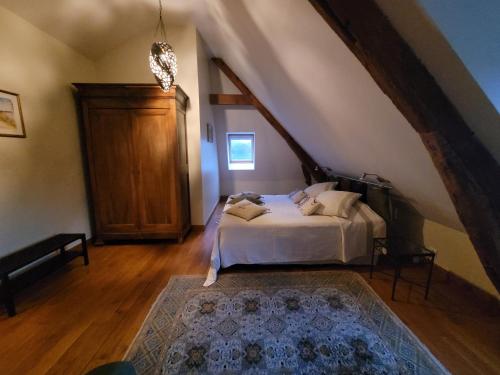 Кровать или кровати в номере Le moulin de Meslon