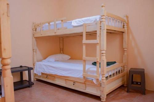a bedroom with two bunk beds in a room at Casa la Ermita in Antigua Guatemala