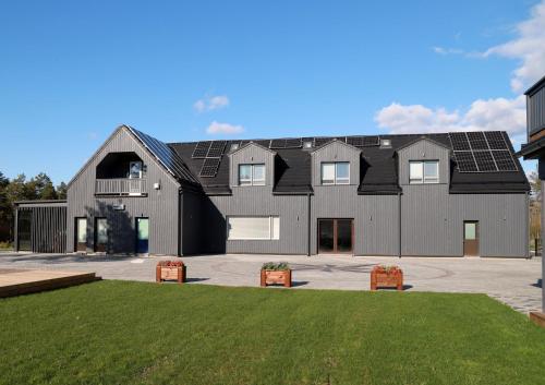 a large house with solar panels on it at Kassikäpa villa in Haapsalu