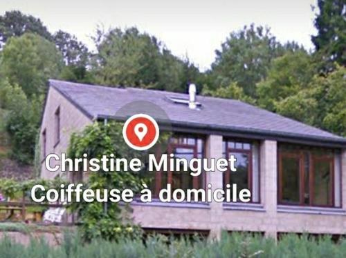 a house with a sign that reads christine minuter confuse a dominate at Bali in Aywaille