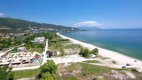 an aerial view of a beach with houses and the ocean at Villa Helen in Asprovalta