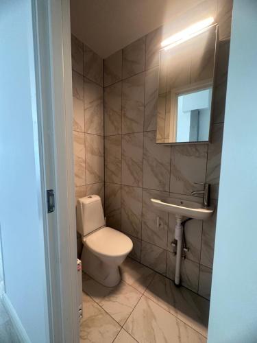 a bathroom with a toilet and a sink at Boende i Borgholm in Borgholm