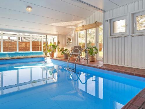 The swimming pool at or close to 8 person holiday home in Nex