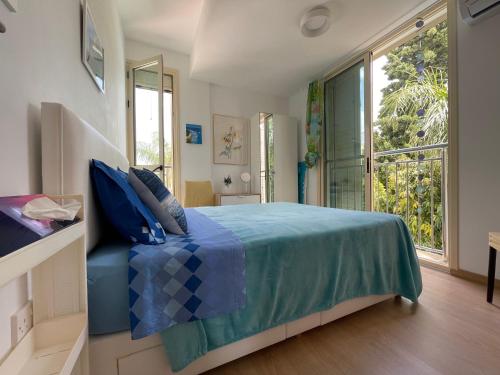 Ένα ή περισσότερα κρεβάτια σε δωμάτιο στο Zoe's villa by Turtle Bay