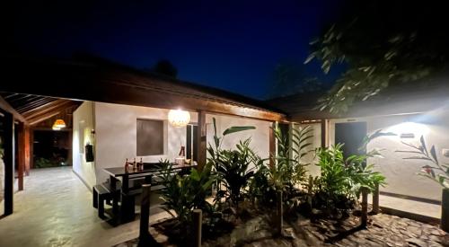 a house with a patio at night at Reserva Natural Tierra Adentro in Minca