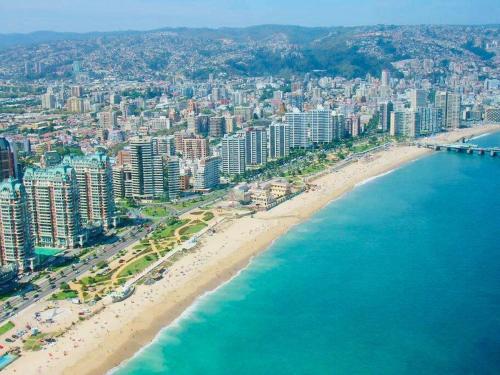 an aerial view of a beach and the ocean at Vista Cordillera Studio in Santiago