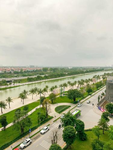 an aerial view of a city with a river and cars at VINHOME OCEAN PARK GIA LÂM in Hanoi