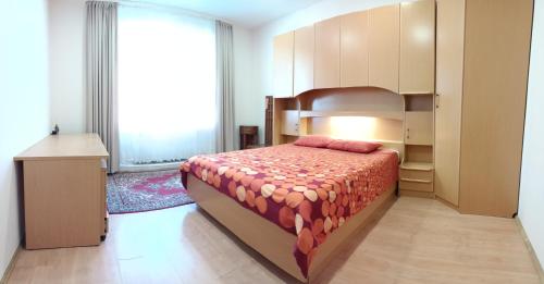 een slaapkamer met een groot bed en een groot raam bij Klaipeda,Lithuania in Klaipėda