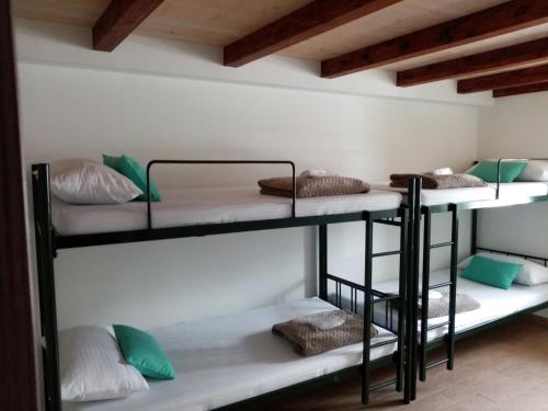 a group of bunk beds in a room at Albergue Oasis in Sarria