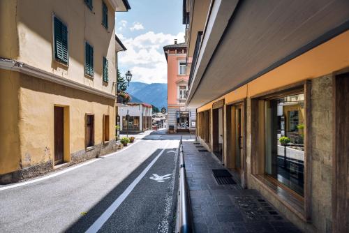an empty street in a town with buildings at Cauriol Suites 2.3 in Cavalese
