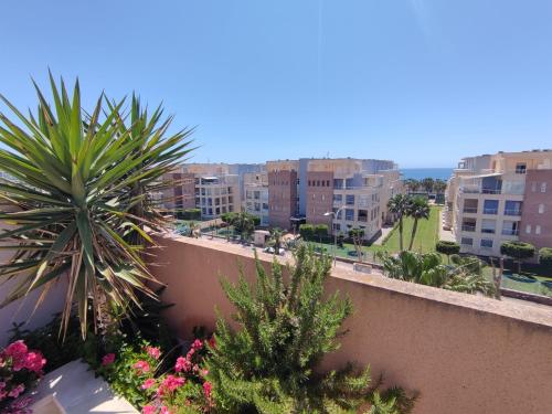 a view of a city from the balcony of a building at Apartamento Ático Laguna Beach Almerimar in Almería