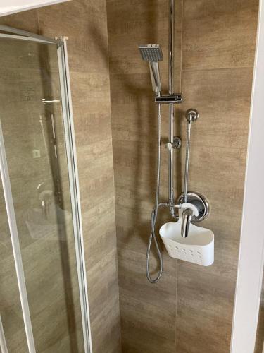 a bathroom with a shower with a sink and a toilet at Dimora AnVi in Bari