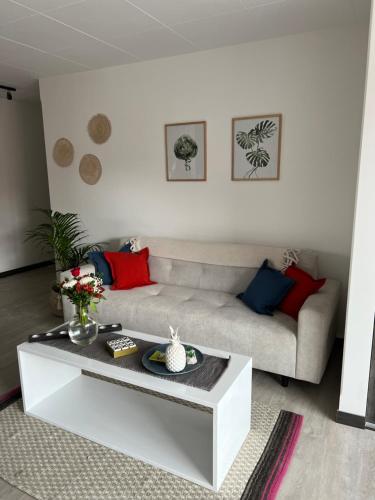 a living room with a couch and a coffee table at Andean Homes in La Paz