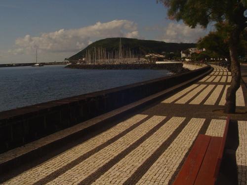 a sidewalk next to a body of water at JAC-Lovely new apartment in Horta Faial Island in Horta