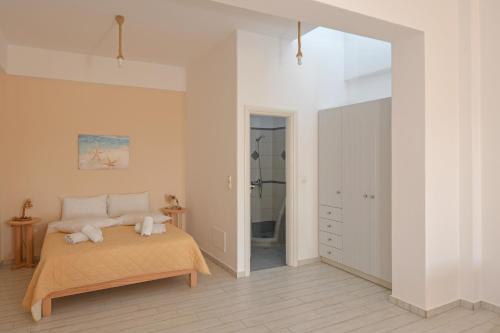 A bed or beds in a room at GYROULI 1