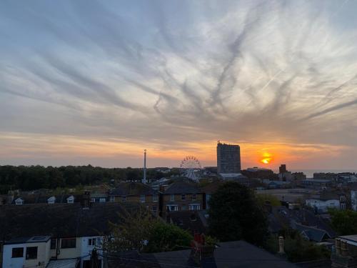 a view of a city with the sun setting at CloudZen in Kent